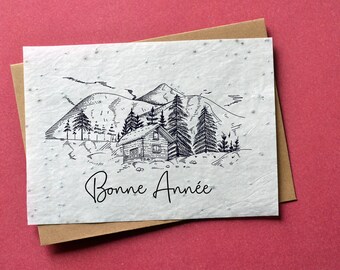 Carte à planter Bonne année Chalet de Montagne. Carte de voeux fleurie.