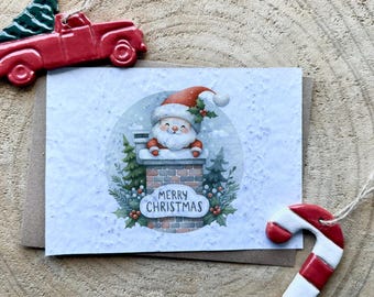 Carte à planter Merry Christmas Père Noël. Carte de voeux fleurie.