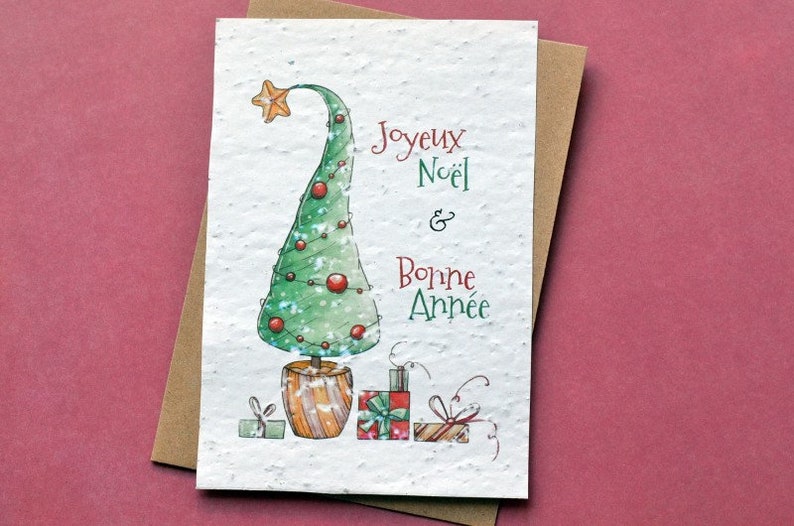 Carte à planter Joyeux Noël Sapin et Cadeaux. Carte de voeux fleurie. image 1