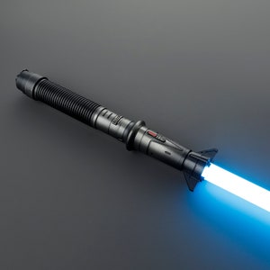 May include: A black lightsaber with a blue blade. The lightsaber has a textured handle and a red button.