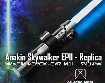 May include: A blue and silver lightsaber with a green and red button. The lightsaber is a replica of Anakin Skywalker's lightsaber from Star Wars Episode III. The text "Anakin Skywalker EPIII - Replica" is visible on the image. The text "GALACTIC SABER STORE" is also visible on the image.