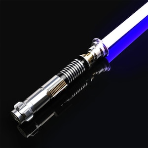 May include: A silver lightsaber with a blue blade. The lightsaber has a black and silver handle with a gold accent.