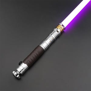 May include: A silver and brown lightsaber with a purple blade. The lightsaber has a leather-wrapped handle and a gold accent.
