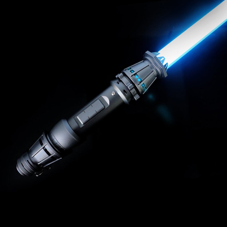 May include: A black lightsaber with a blue blade. The lightsaber has a detailed handle with a silver accent.