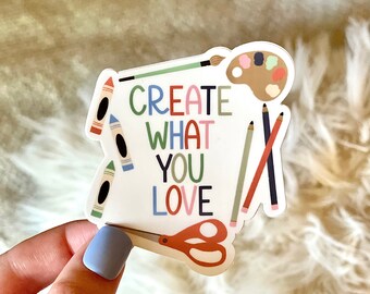 May include: A white sticker with colorful art supplies and the text "CREATE WHAT YOU LOVE".