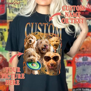 A person wearing a black t-shirt with a graphic design featuring a group of dogs, including a dog wearing sunglasses. The design includes text that allows the wearer to customize the image by adding a name or text.