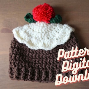 May include: A brown and white crocheted hat shaped like a Christmas pudding with a red pom-pom on top. The hat has green leaves on the side. The text "pattern digital download" is written in pink and white letters on a brown background.