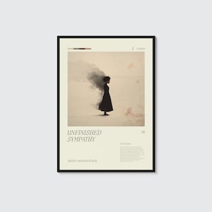 May include: A framed art print featuring a woman in a black dress standing in a desolate landscape with a dark cloud. The print includes the text "UNFINISHED SYMPATHY" and "ARTIST: MASSIVE ATTACK". The artwork has a minimalist aesthetic.
