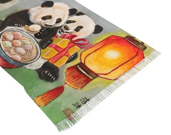 May include: A rectangular scarf featuring a watercolor illustration of pandas, a gift, a bowl of food, and a lantern. The scarf has a green and gray background with a fringed edge. The design has a Chinese theme.