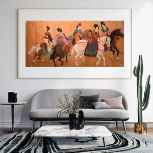 May include: A painting depicting six women riding horses. The women are wearing colourful traditional clothing and riding white and brown horses. The background is a light brown colour.