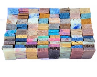May include: A collection of handmade soap bars in various colors and patterns. The bars are arranged in a grid pattern, with each bar measuring approximately 2 inches by 3 inches. The soap bars are made with natural ingredients and are free of harsh chemicals.