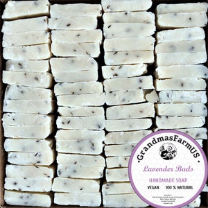 May include: A box of 48 bars of white handmade soap with lavender buds. The soap is labeled "Grandma's Farm US. Lavender Buds Handmade Soap. Vegan 100% Natural."