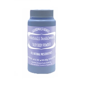 May include: A lavender-colored plastic jar with a white label that reads "GRANDMASFARMUS Patchouli Sandalwood SILKY BODY POWDER ALL NATURAL PRESERVATIVES CORN FREE TALC FREE NON GMO PHTHALATE FREE Ingredients: Arrowroot Powder, Kaolin Clay, Aspen Bark Extract Essential or Fragrance Oil"
