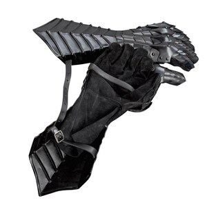 May include: Black leather gauntlets with metal plates and finger guards. The gauntlets are designed to protect the hands and forearms during combat.
