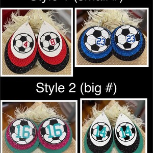 May include: Four pairs of soccer ball-themed earrings. Style 1 features small numbers on red, white, and black layered teardrop shapes. Style 2 has larger numbers on teal, pink, and black layered teardrop shapes. The earrings are displayed on a neutral background.