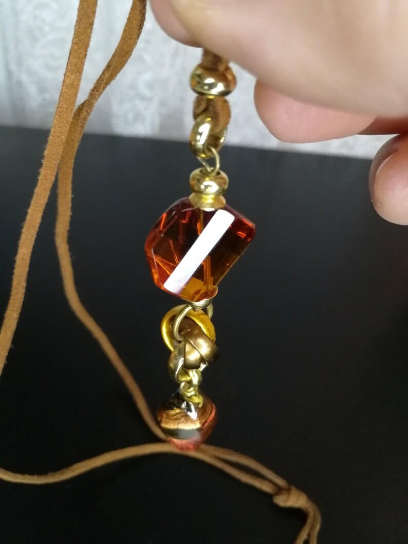 brown leather necklace with colored glass pendant