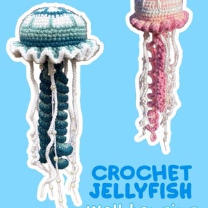 May include: Two crochet jellyfish wall hangings. One is teal and white, the other is pink and white. Both have long, dangling tentacles with pearl accents. The text "CROCHET JELLYFISH wall hanging" is at the bottom.