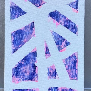 May include: Abstract painting on canvas with a white background and a pattern of blue and pink geometric shapes. The painting is signed "ADS 19" in the bottom right corner.