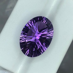 Oval Amethyst Gemstone: 14.30 Carat Natural Purple Concave Cut
