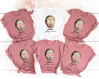 May include: Five pink and white t-shirts with a bride-to-be theme. Each shirt features a photo of a woman wearing sunglasses and a tiara with the text "I'm Emily getting married" or "Emily's getting married".