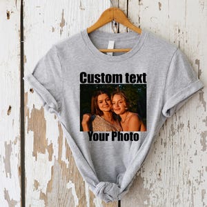 a t - shirt with a picture of two women on it
