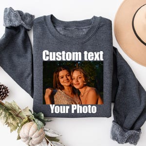 a sweater with a picture of two women on it
