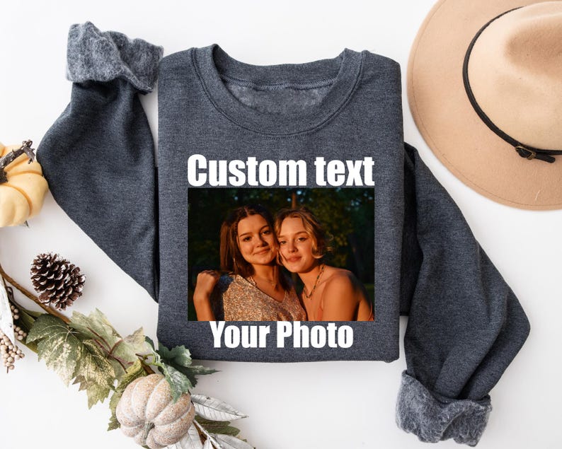a sweater with a picture of two women on it