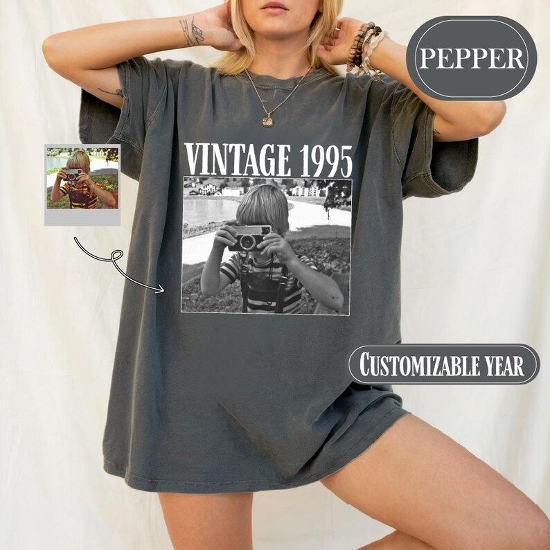 a woman posing for a picture wearing a vintage t - shirt