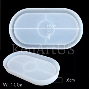 Puede incluir: Molde de bandeja ovalada de silicona blanca con dos c&iacute;rculos interiores. El molde mide 18 cm de largo, 9,5 cm de ancho y 1,6 cm de profundidad. W: 100 g