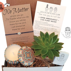 May include: A gift box with a succulent plant, a candle, and a wish bracelet. The box has a card that says "No Matter where you go No Matter what you do I know you will be there for me and I will always be there for you!"  The card also has a string tied around it with a charm. The candle is in a tin with a colorful mandala design. The succulent plant is in a small brown pot. The box is filled with brown paper shreds.
