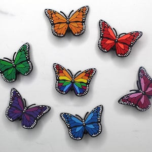 Encantos de zapatos mariposa