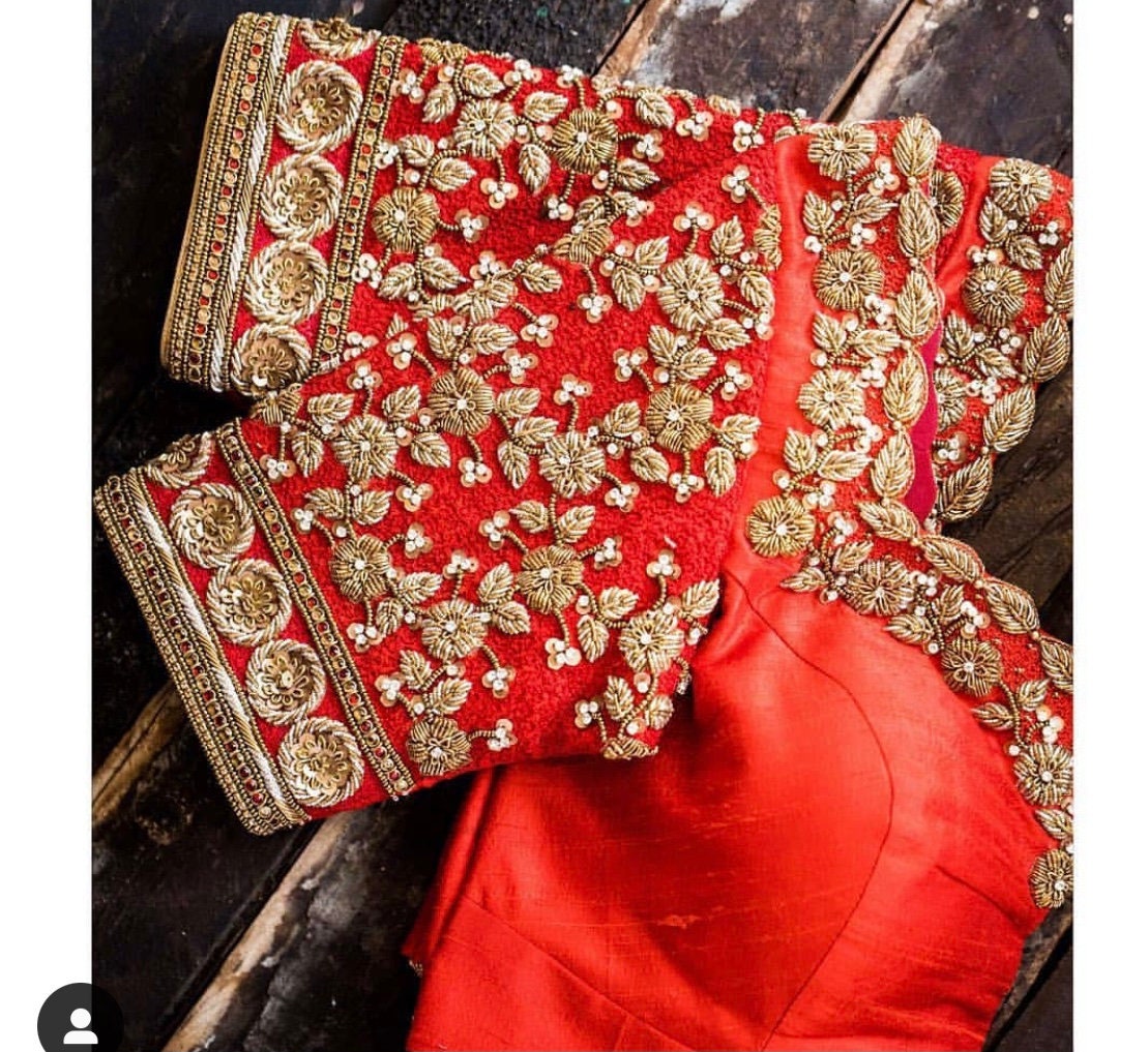dark orange maggam work blouse with silver zari work