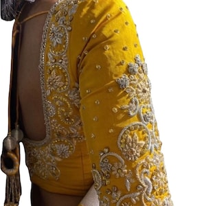 Yellow pure silk blouse with different shades of antique Zardozi,stones,Kundan work on all over blouse