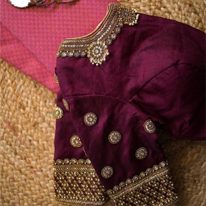 Raw silk Necklace inspired blouse with antique Zardozi work on sleeves and neckline