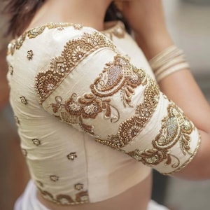 Raw Silk off white Maggam blouse with different shades of Antique Zardozi flowers work all over blouse