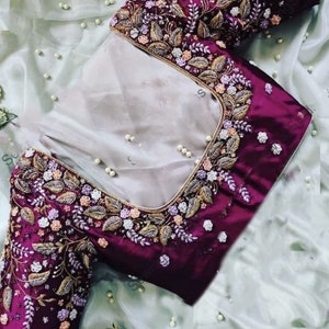 Stunning hand made blouse with different shades of Zardozi, Pearl and thread work.