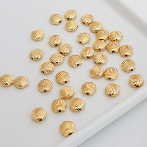 14 kt vergulde schelpkralen: 9 mm bedelkralen (50 stuks)