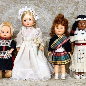 Four 1950s Dolls include a Bride Doll and 3 Sleepy Eye Dolls.