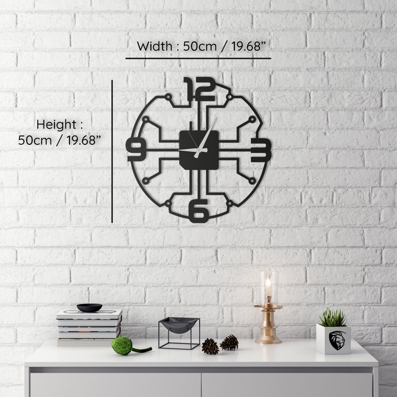 May include: Black metal wall clock with a circuit board design. The clock is 19.68 inches in diameter and features a white clock hand.