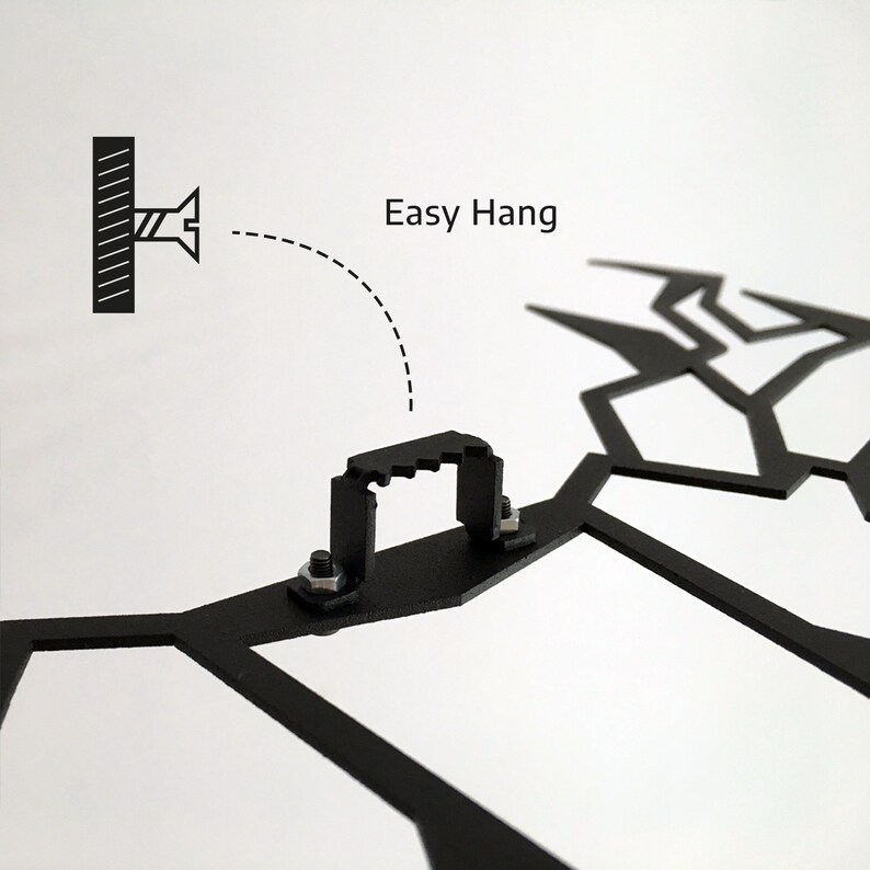 May include: Close-up of a black metal wall art piece with a geometric design. The image shows the mounting hardware, including a bracket and screws, with the text "Easy Hang" indicating ease of installation.