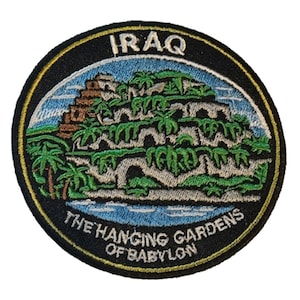 May include: Embroidered patch featuring a depiction of the Hanging Gardens of Babylon, with the word "IRAQ" at the top. The design includes palm trees, arched structures, and the text "THE HANGING GARDENS OF BABYLON". The patch has a black background with a yellow border.