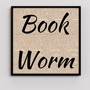 May include: A black and white image of the words "Book Worm" superimposed on a page of text from a vintage book. The text is faded and yellowed, giving the image a vintage aesthetic.