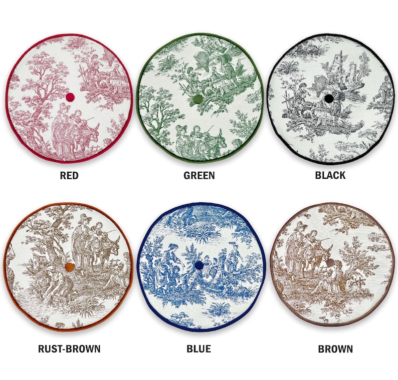 May include: Six round decorative tree skirts in various colors, each featuring a toile pattern. Colors include red, green, black, rust-brown, blue, and brown. Each skirt has a contrasting border and a central hole for the tree trunk.