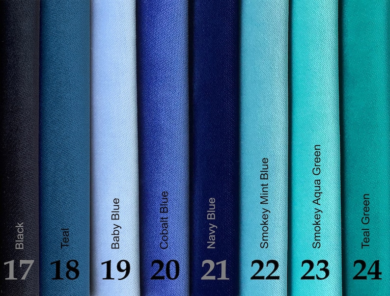 May include: A color palette of fabric swatches in shades of blue and green. The colors include black, teal, baby blue, cobalt blue, navy blue, smokey mint blue, smokey aqua green, and teal green. Each swatch is labeled with its color name and a number from 17 to 24.