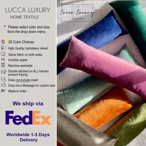 May include: A set of six long, rectangular pillows in various colors, including teal, orange, gray, green, pink, and blue. The pillows are made of velvet and have a soft, plush texture. The pillows are arranged in a staggered pattern on a white surface. The text "THE lucca luxury COLLECTION" is visible in the top right corner of the image.