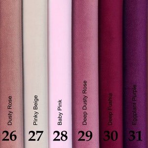 May include: A color palette of fabric swatches in shades of pink, rose, and purple, including Blush Pink, Dusty Rose, Pinky Beige, Baby Pink, Deep Dusty Rose, Deep Fushia, Eggplant Purple, and Mustard Yellow. Each color is labeled with a name and a number.