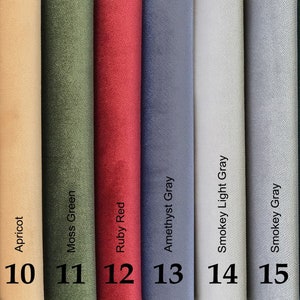 May include: A color palette featuring swatches of fabric in various shades. Colors include dark brown, apricot, moss green, ruby red, amethyst gray, smokey light gray, smokey gray, and dark emerald green. Each swatch is labeled with its color name and a corresponding number.
