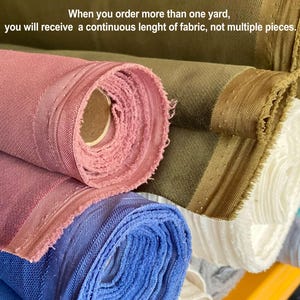 May include: Rolled fabric in various colors, including pink, blue, and olive green. The image shows multiple rolls of fabric, with the text: "When you order more than one yard, you will receive a continuous length of fabric, not multiple pieces."