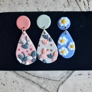 Floral designed clay earrings, leaves daisy jewelry. Spring bright fun statement pieces,
