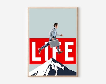 May include: A framed art print featuring a man in a suit leaping over a mountain. The word "LIFE" is displayed in white letters against a red background. The artwork has a light blue sky background.